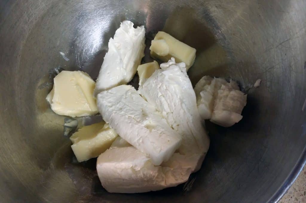 cubed butter and cream cheese in stainless steel bowl