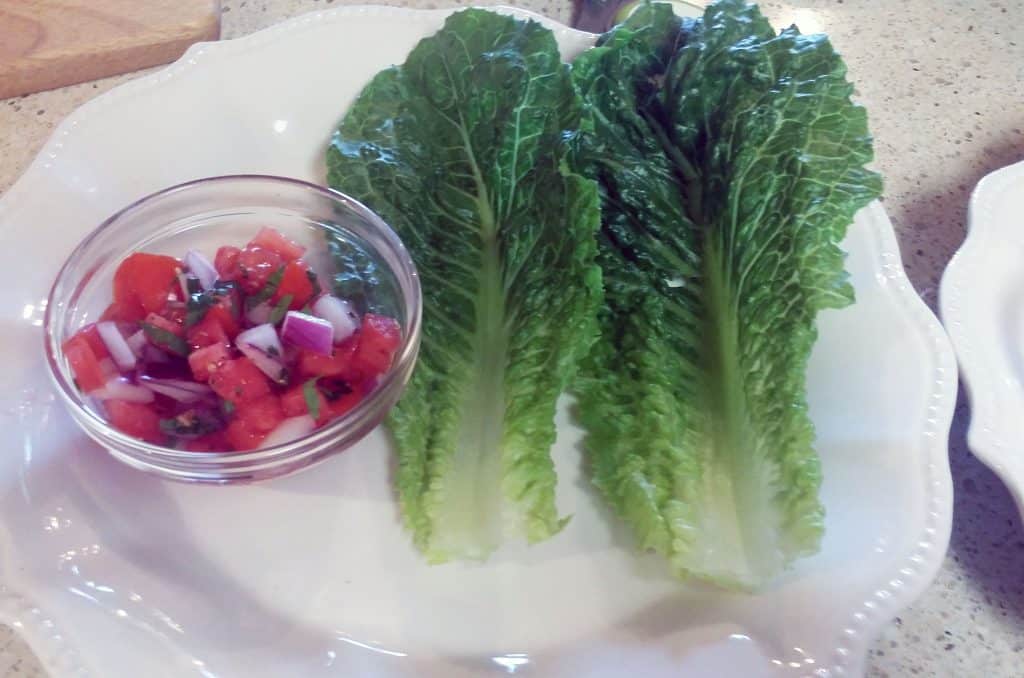 Romaine lettuce leaves on plate for taco boats