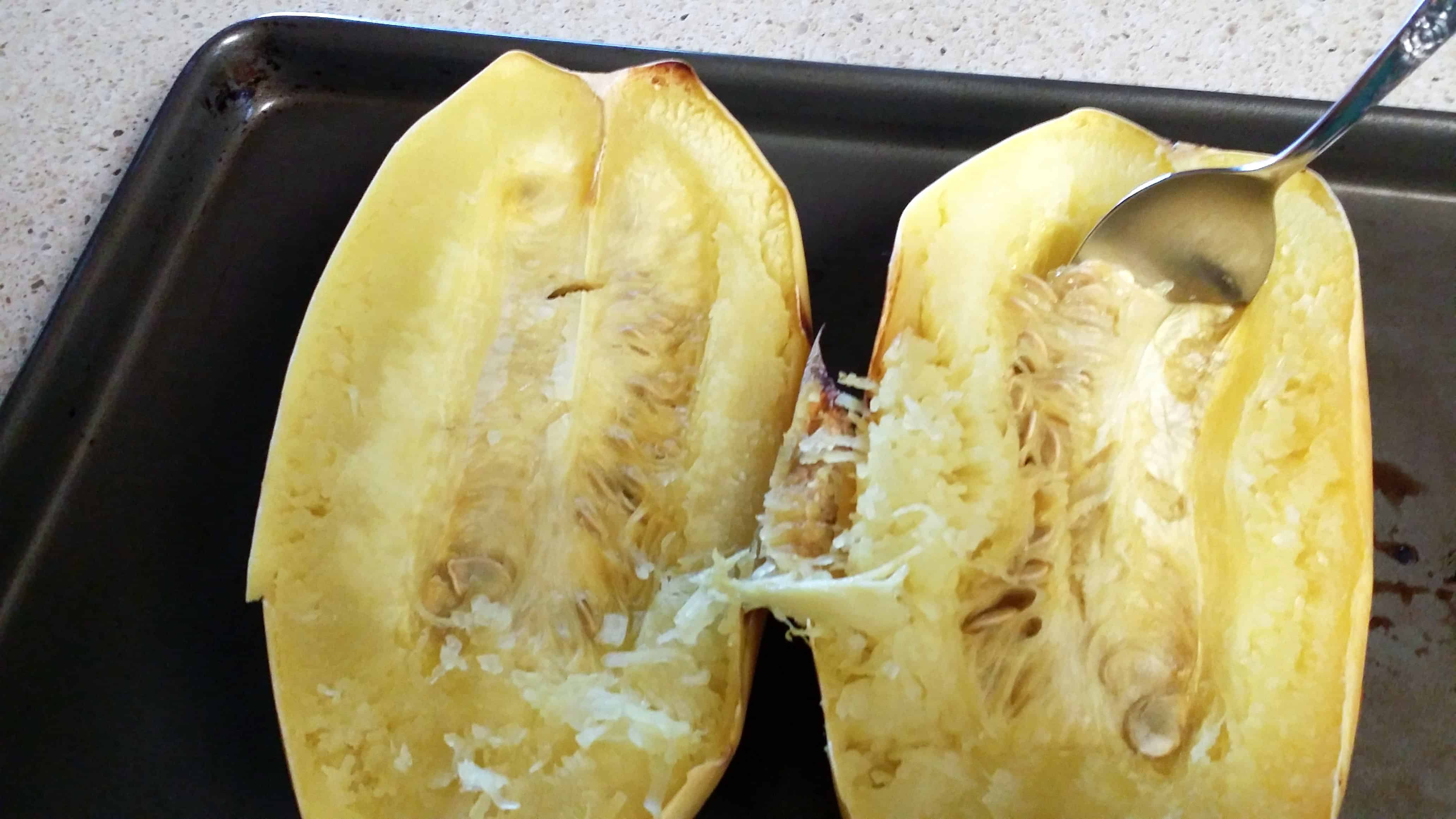 Scoop seeds out of spaghetti squash