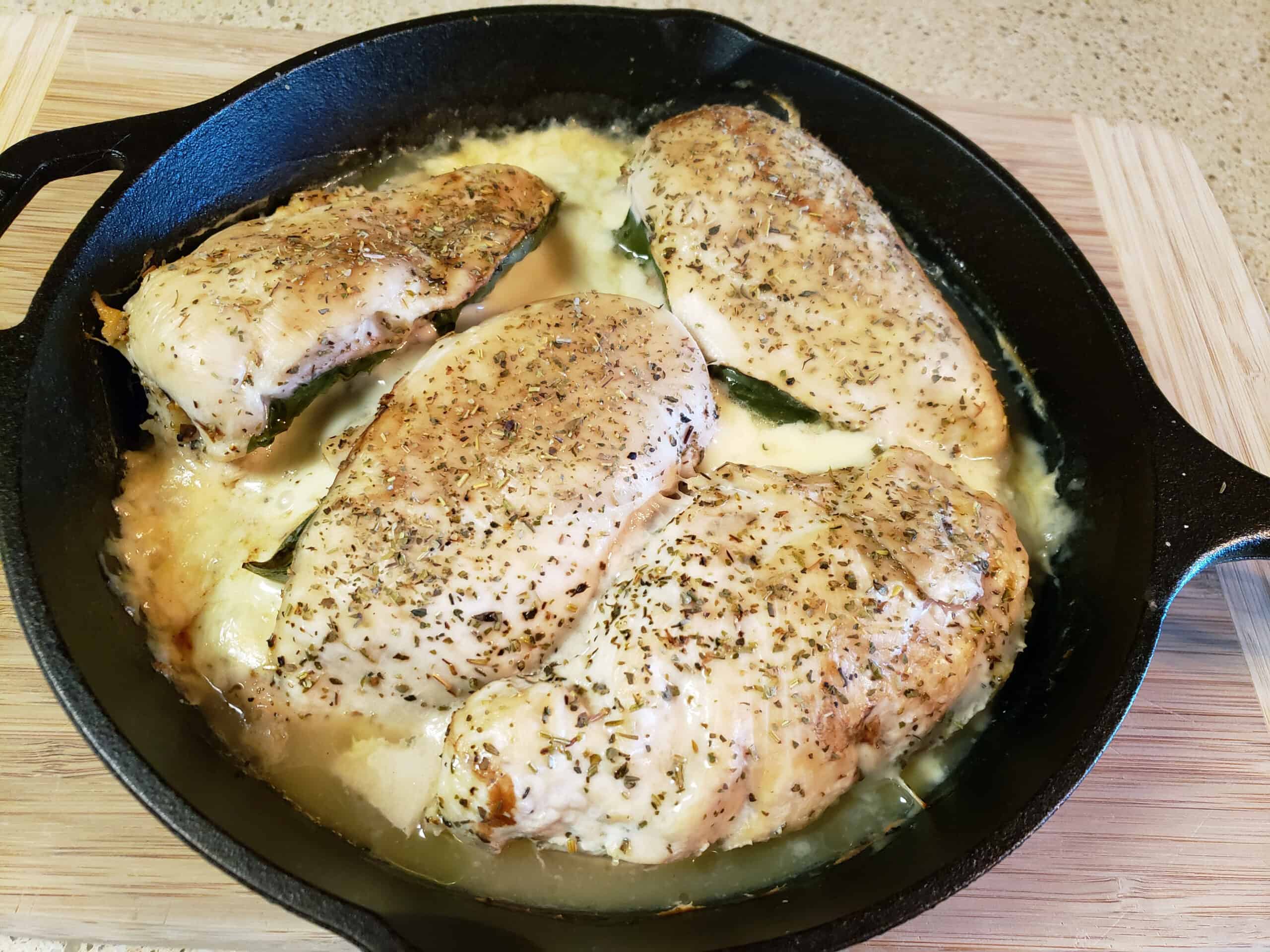 baked stuffed chicken in cast iron skillet